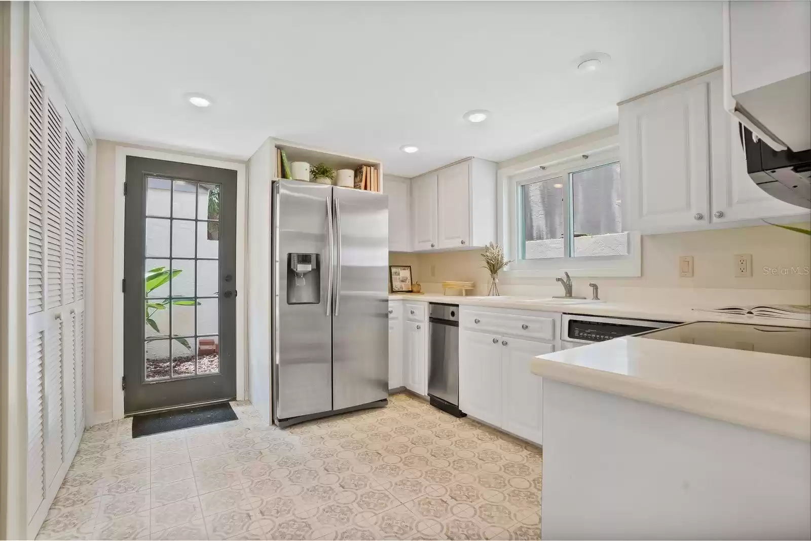 New tile, stainless steel appliances