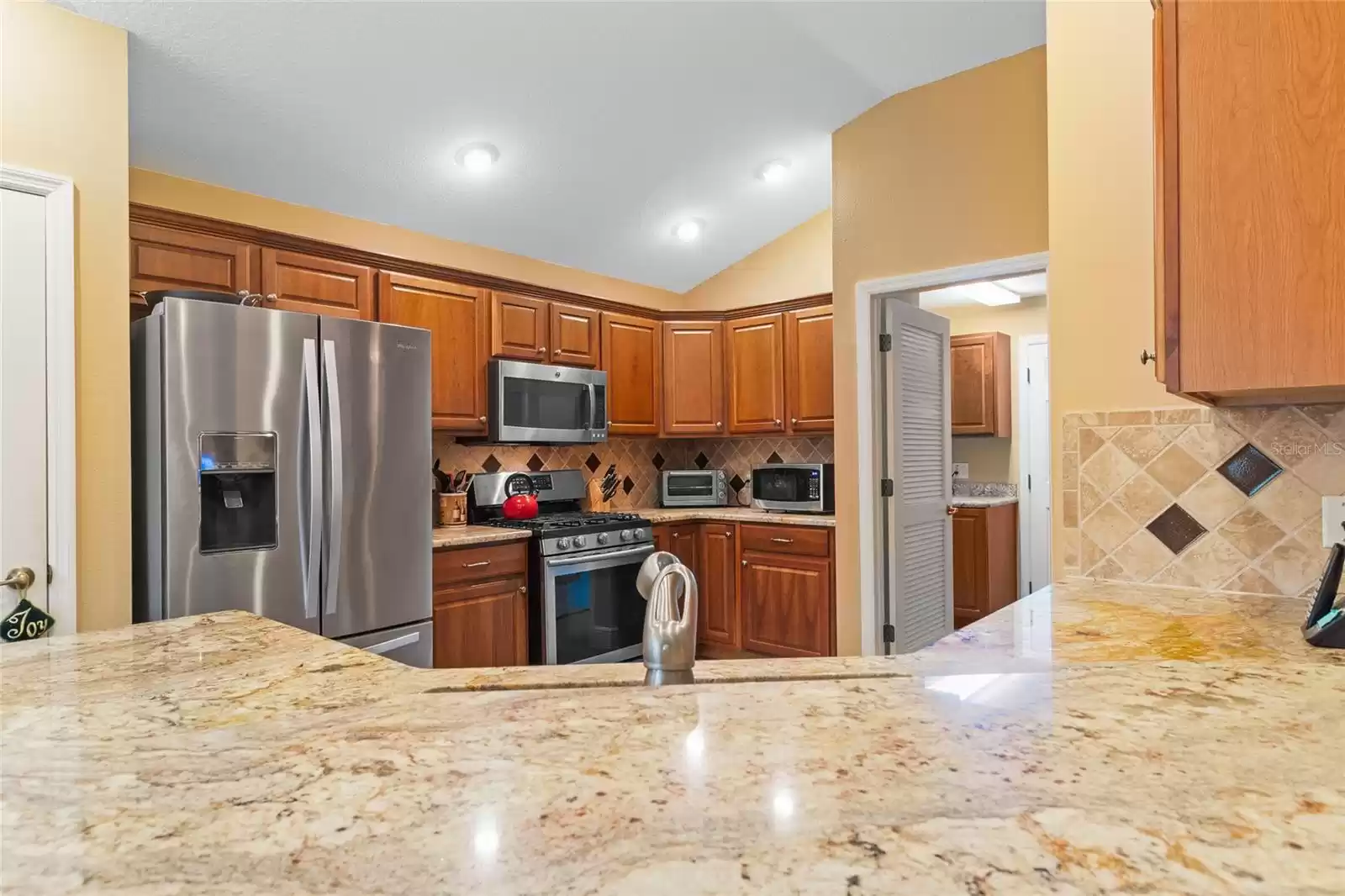 Granite countertops with tiled backsplash