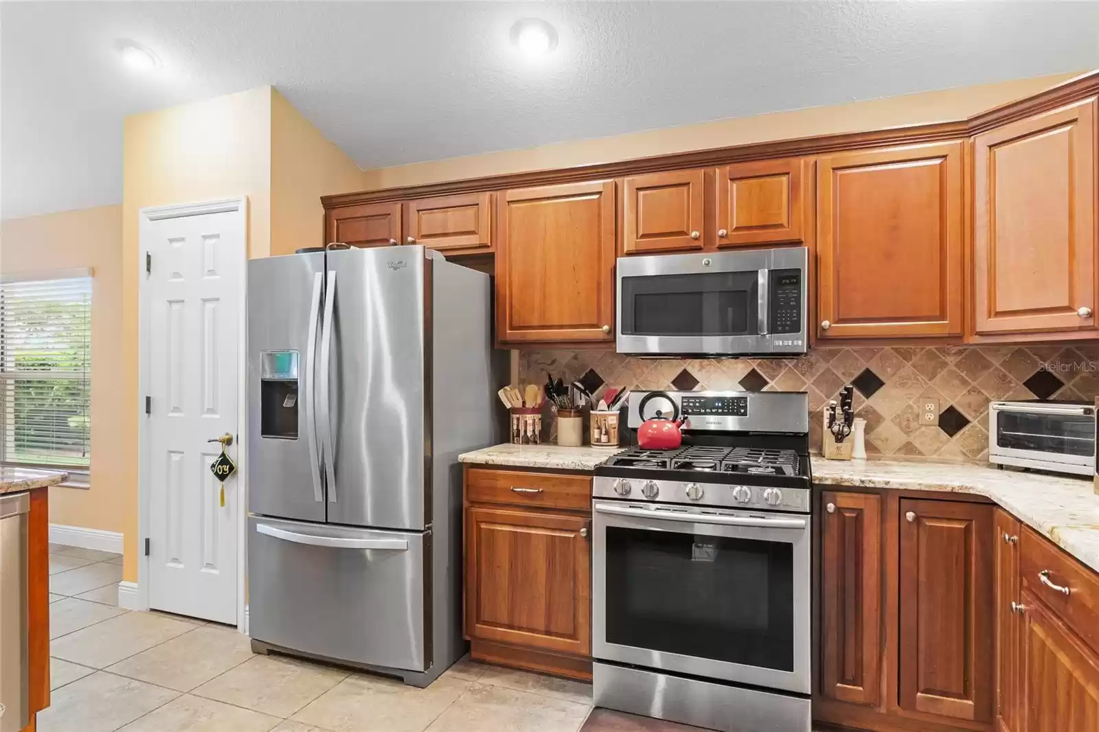 Kitchen pantry and wood cabinets for plenty of storage