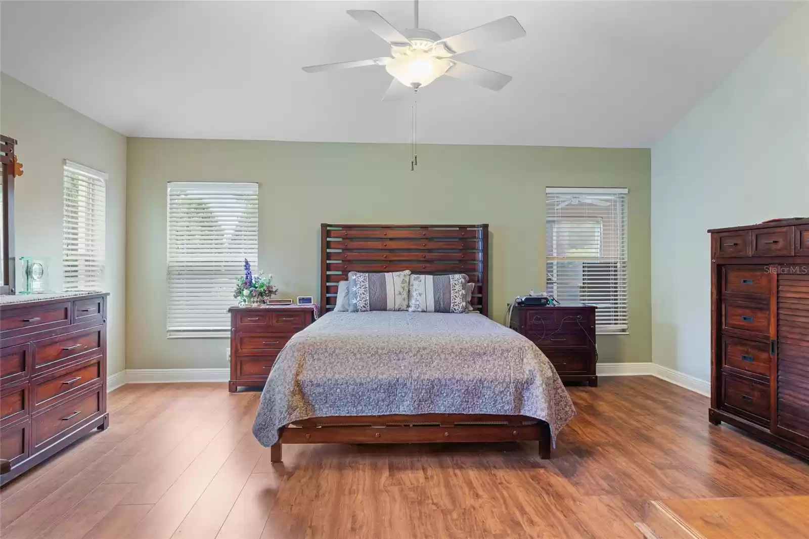 Large primary bedroom with room for a king size bed.