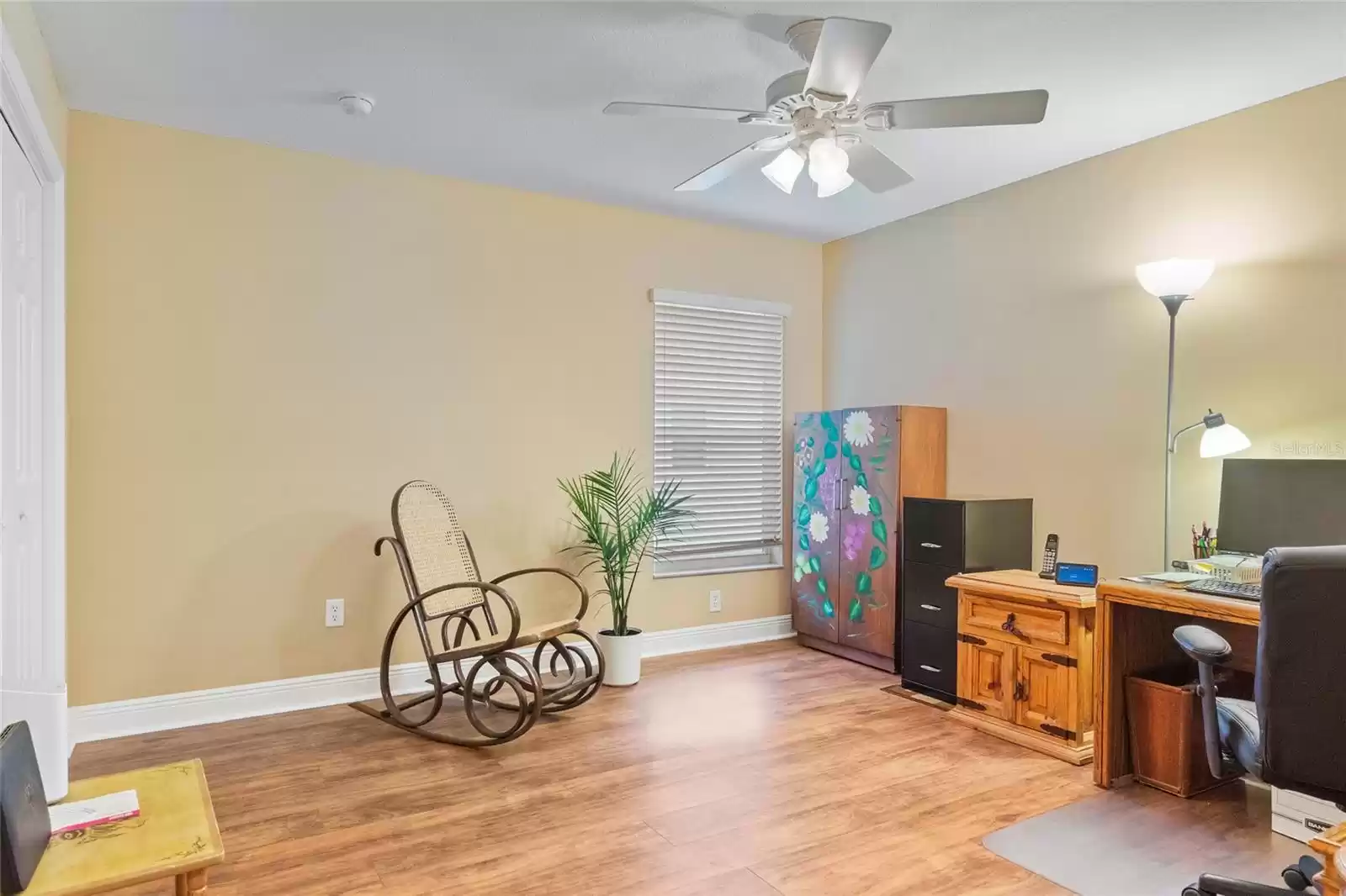 12' x 12' second guest bedroom was used as a home office.  Closet with bifold doors is on the left.