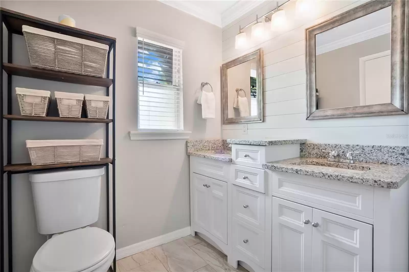 Primary Bathroom featuring dual sink vanity with plenty of storage