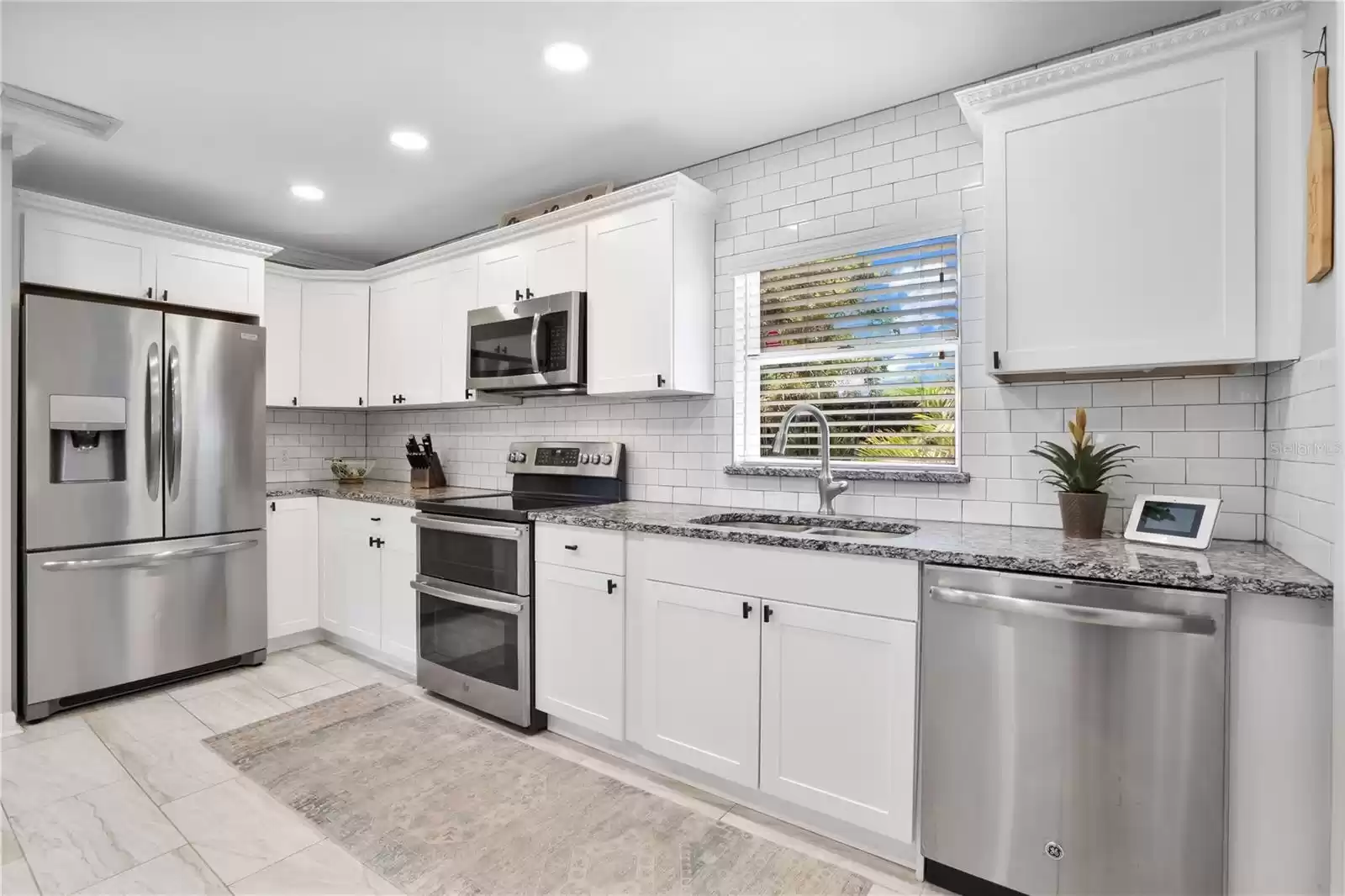 Kitchen overlooking BACKYARD