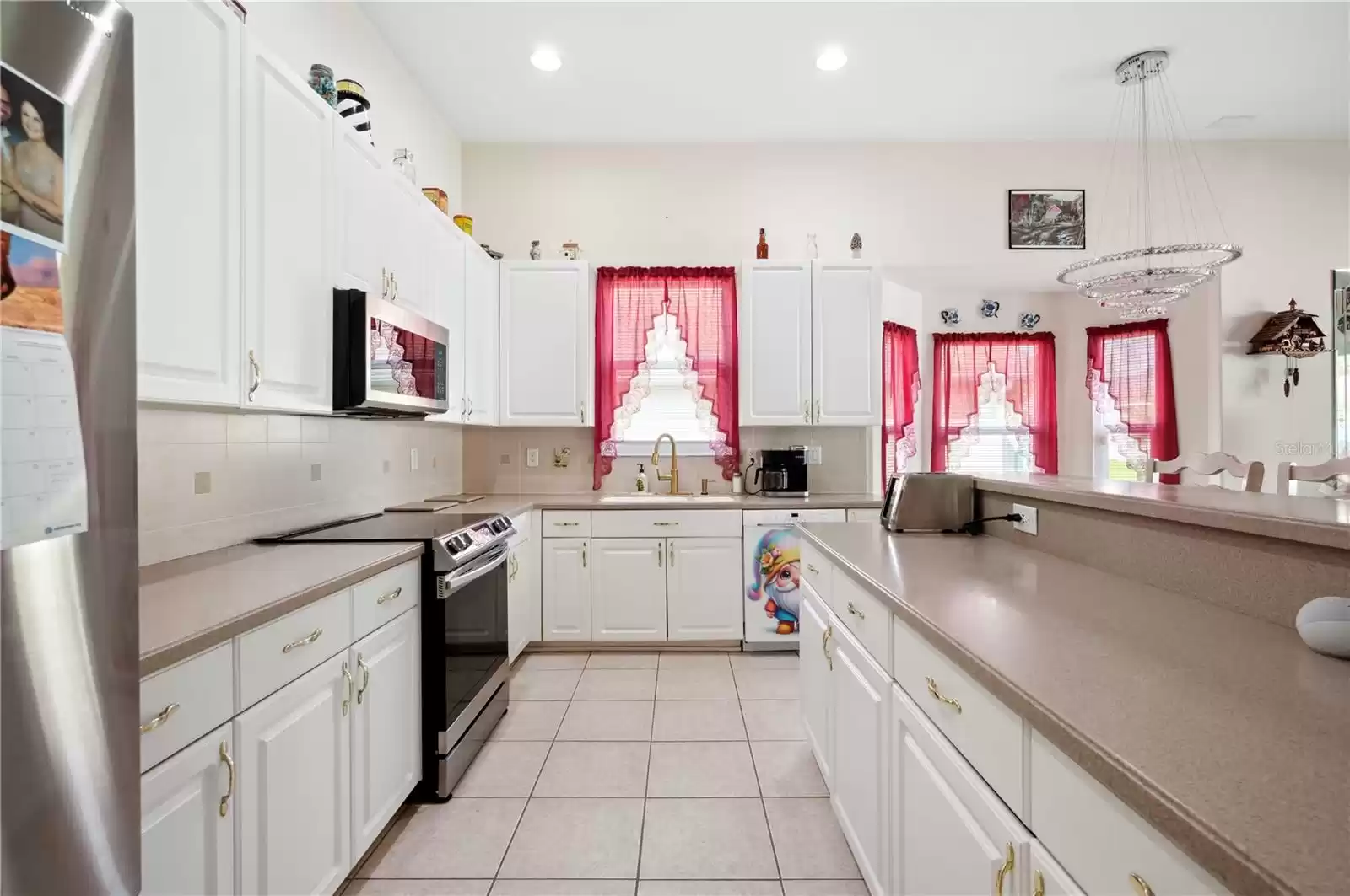 Kitchen offers, stainless-steel appliances, Corian countertops, chandelier, and so much more.