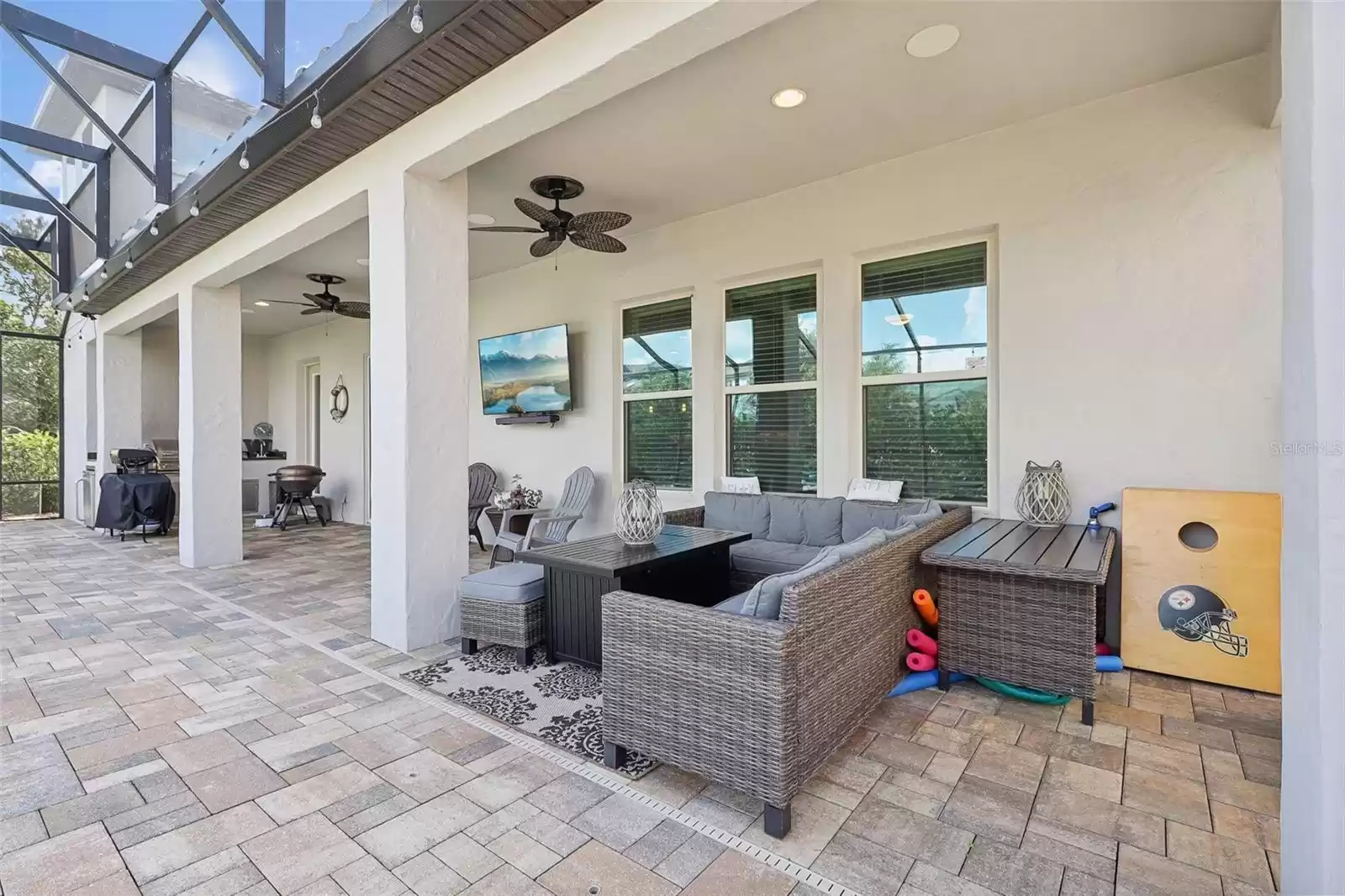 Relax under the covered lanai as you watch the children swim.