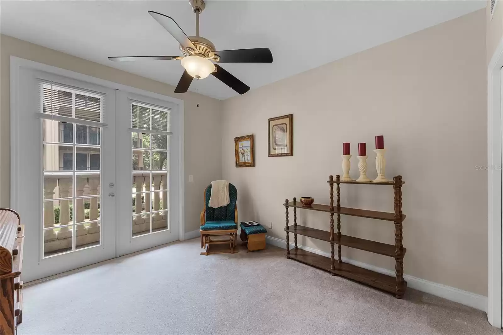 Bedroom two has private balcony access.