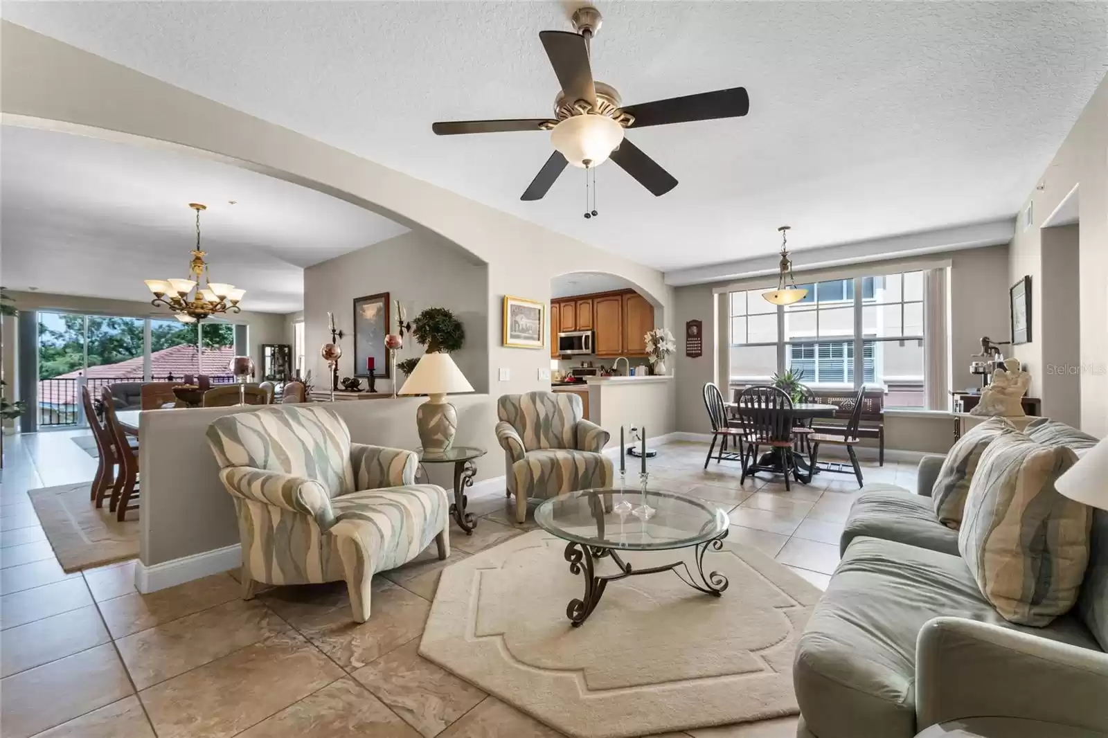 A view from the living room into the dining room and beyond that the family room.