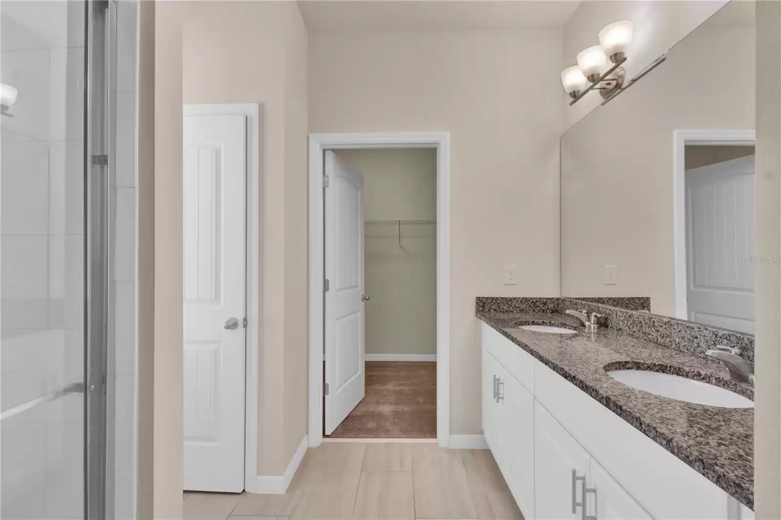 Primary on-suite bathroom with walk-in closet