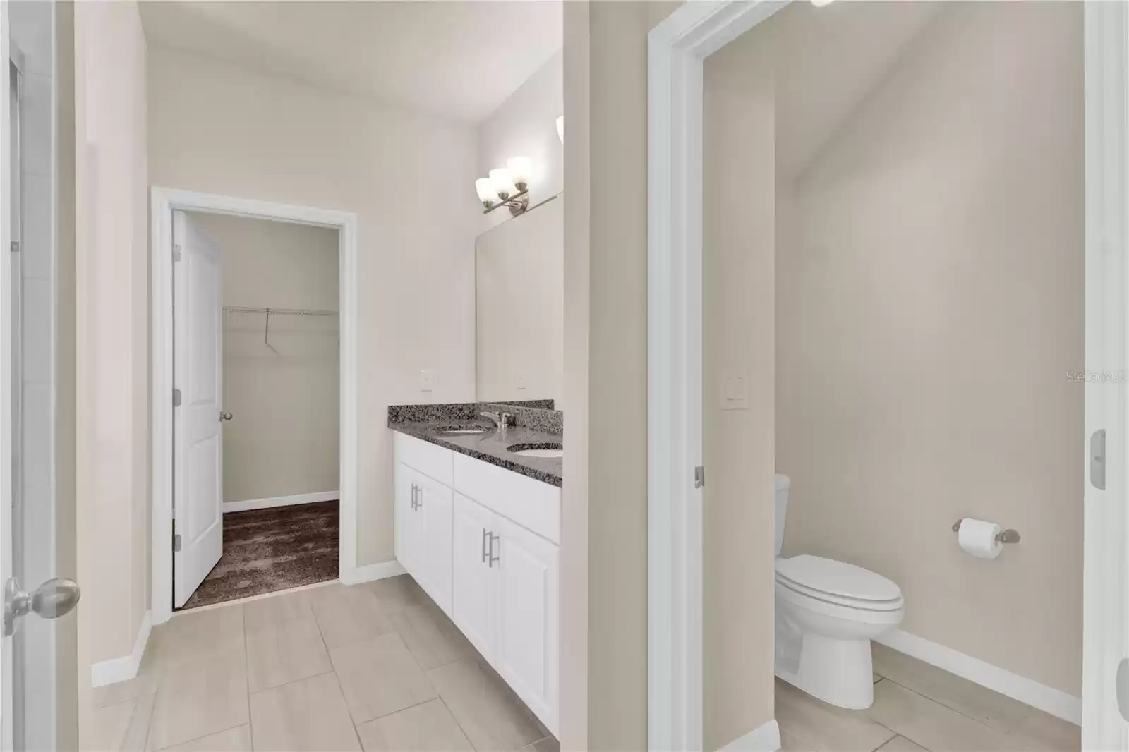 Primary on-suite bathroom with walk in closet