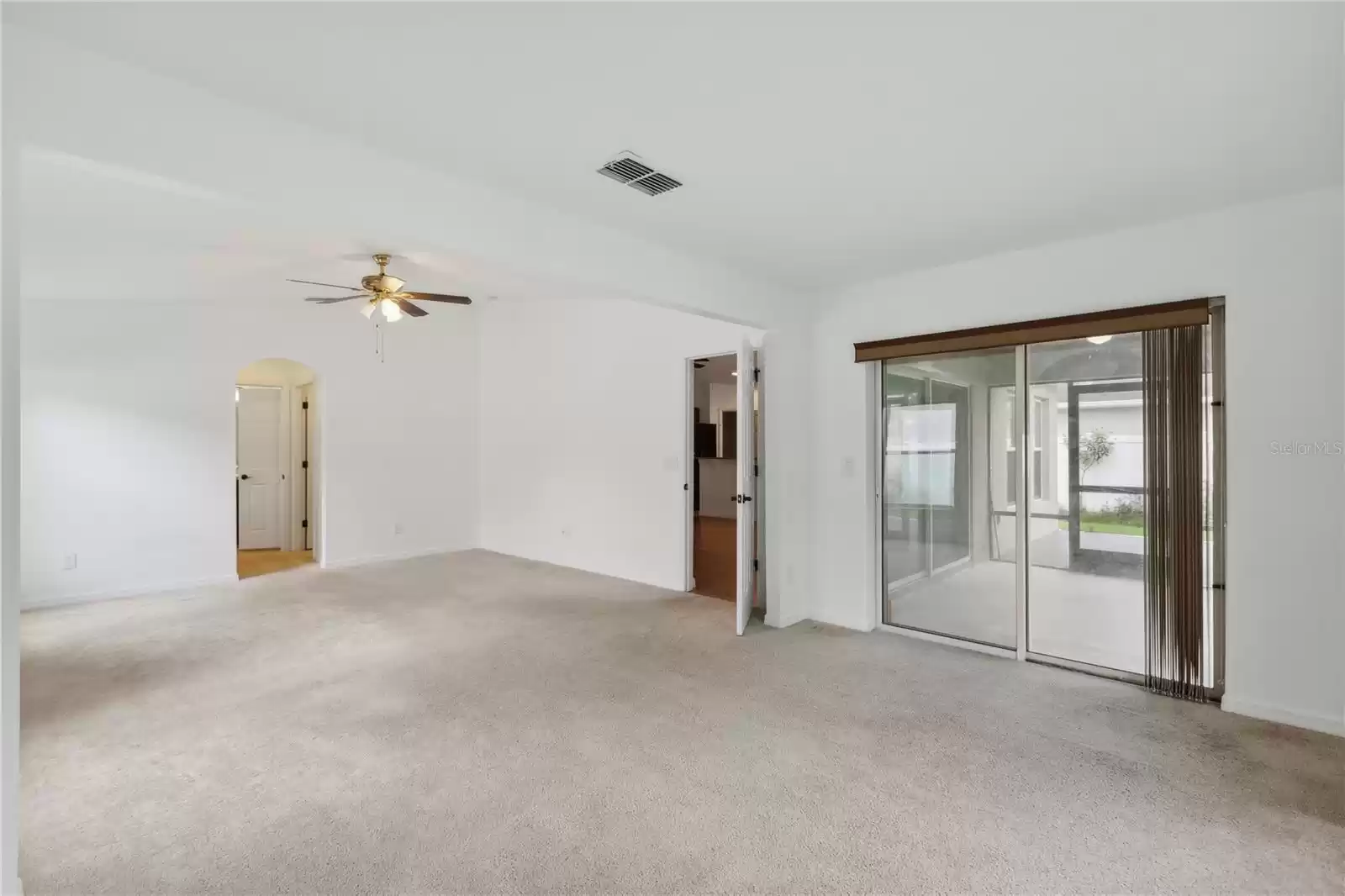 View of sitting room and master suite - access to the lanai via sliding glass doors