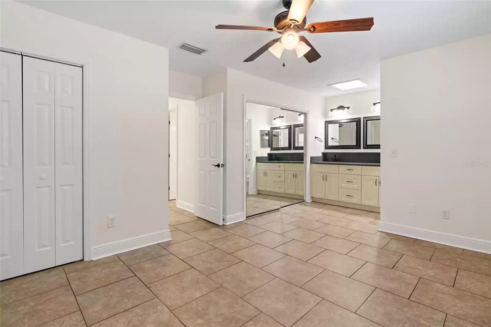 Master bedroom with his and hers closet