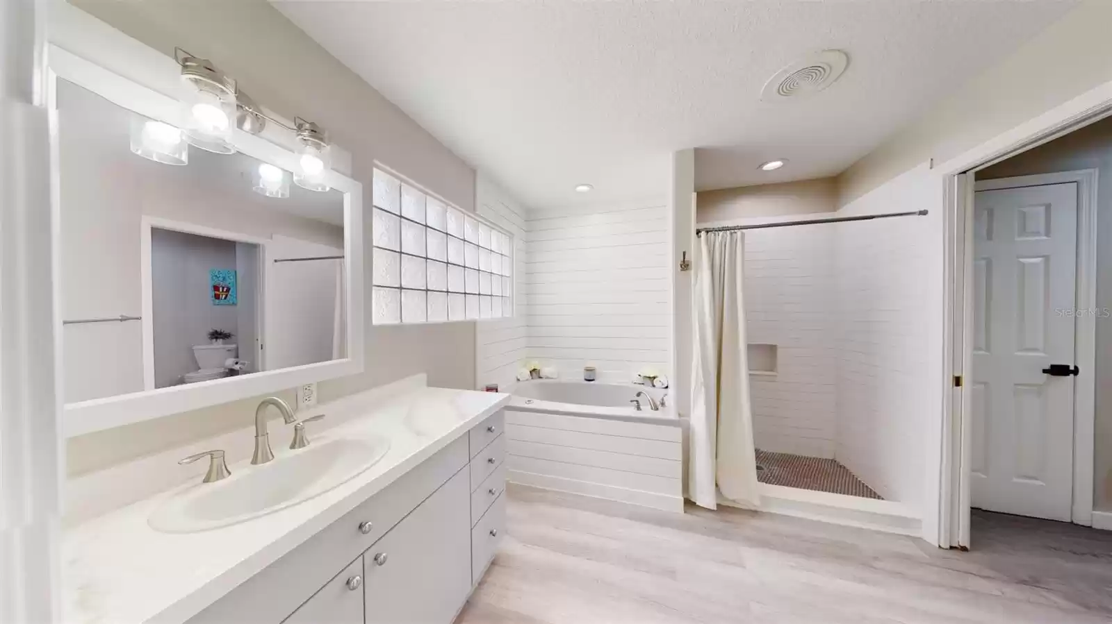 Master Bath 1st floor with 2nd vanity, tub and shower