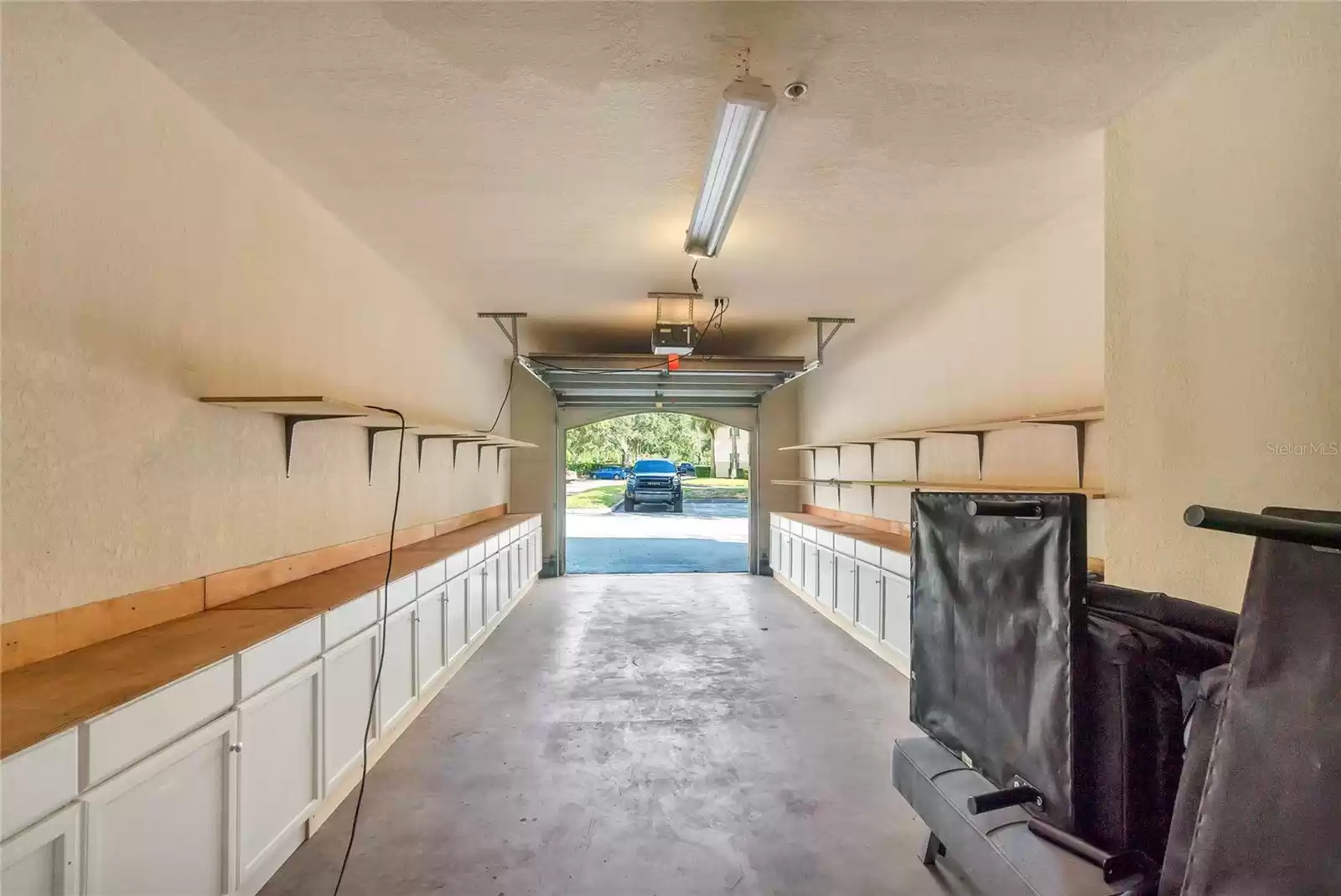 This is another garage shown as an example. Cabinets may not be present in unit's specific garage.