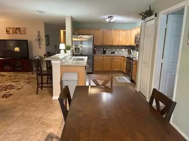 Dinette area overlooking kitchen and family room