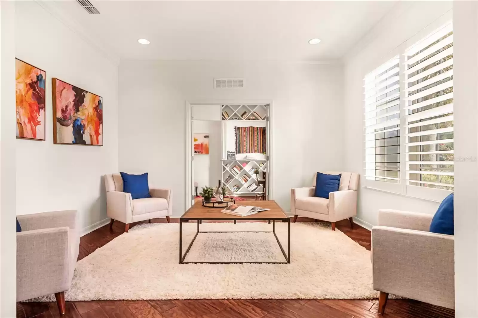 living room with french doors to library