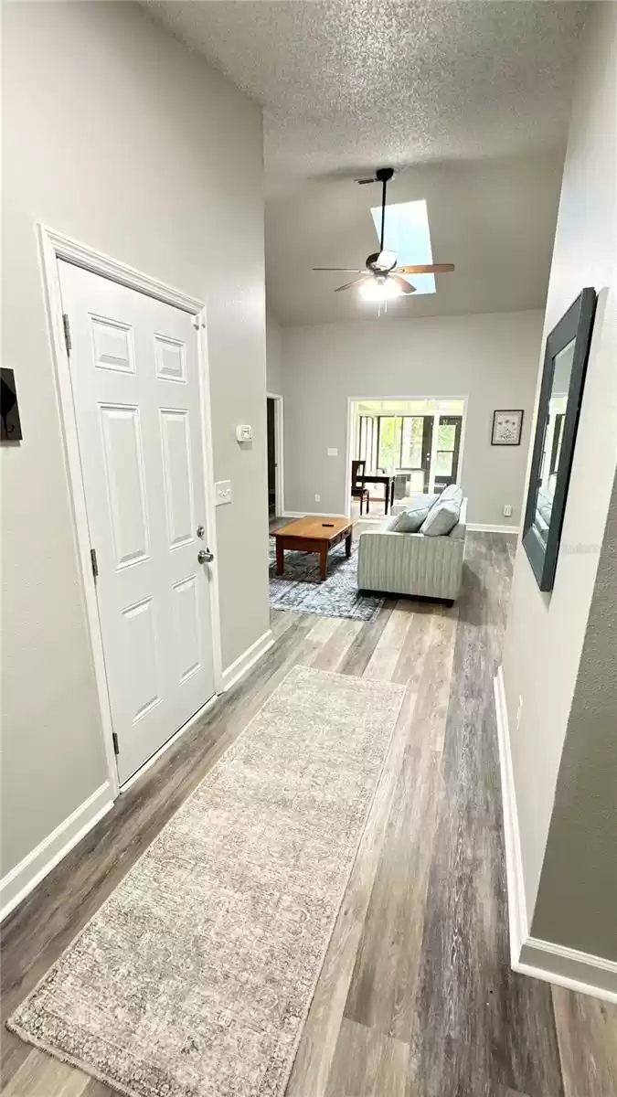 Entry hallway, guest rooms on right garage door on left