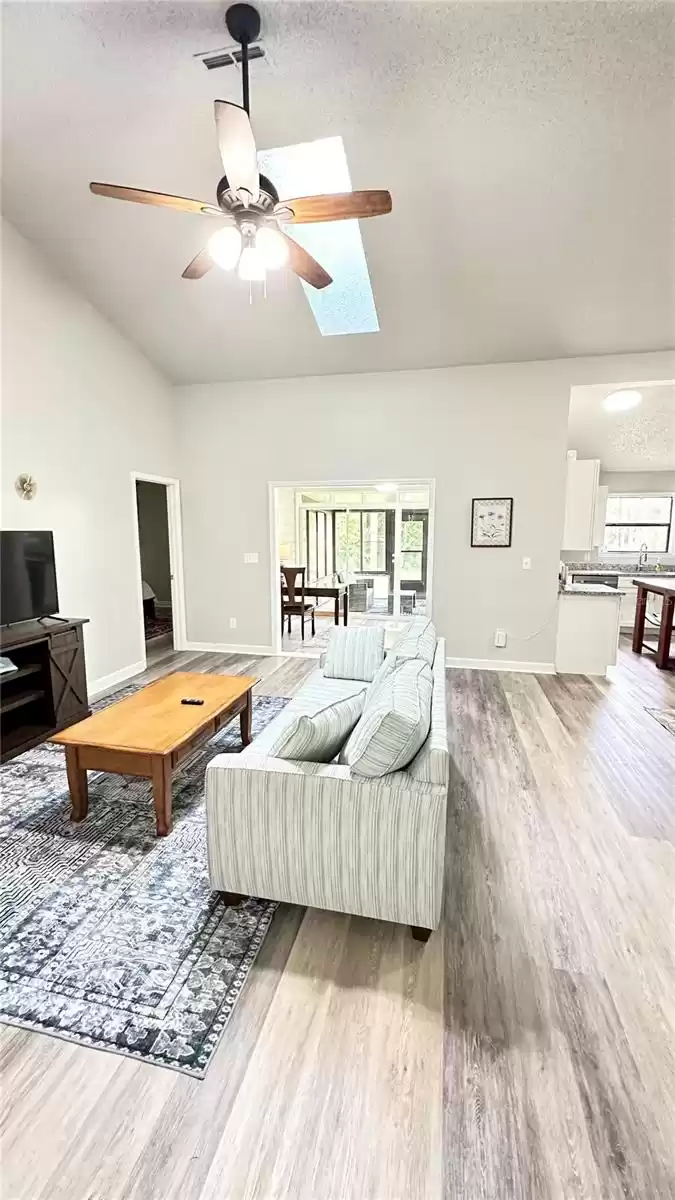 Vaulted ceilings with sky light in great room