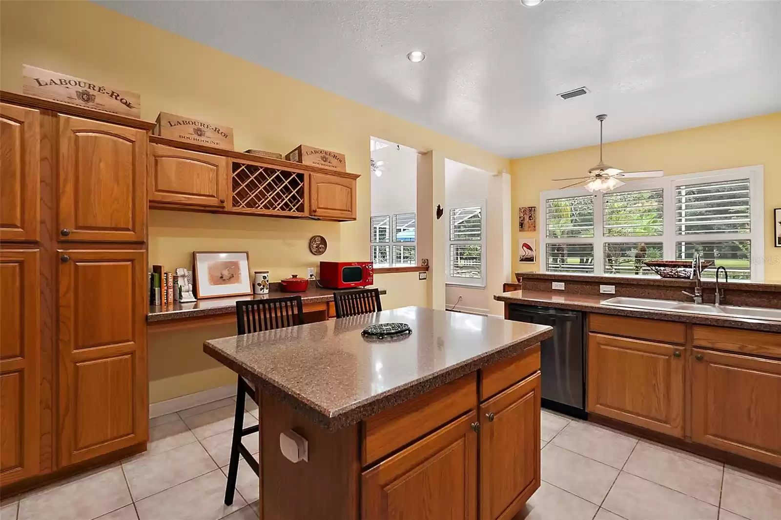 Tucked behind the double sink is the breakfast nook overlooking the pool.