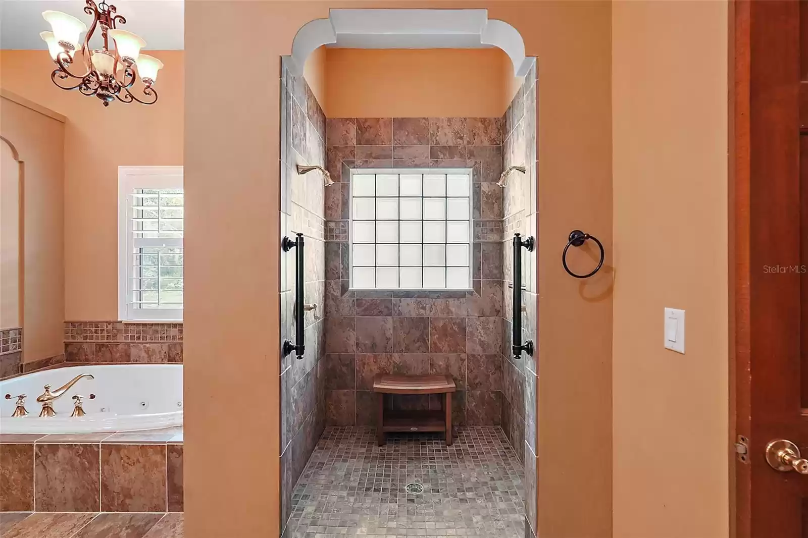 Shower stall with dual shower heads.