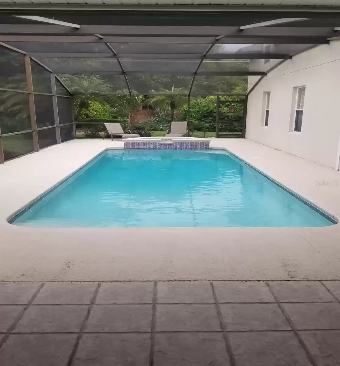 SCREENED IN POOL WITH RUNNING FOUNTAIN