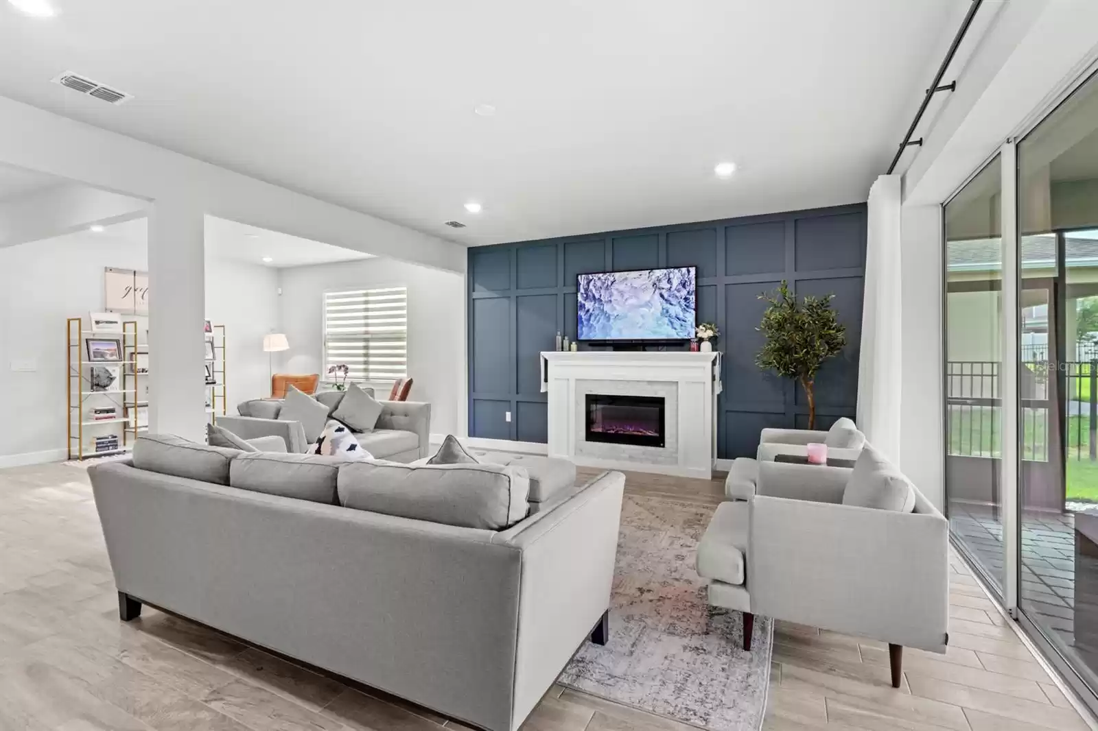 Living room with custom accent wall and fireplace