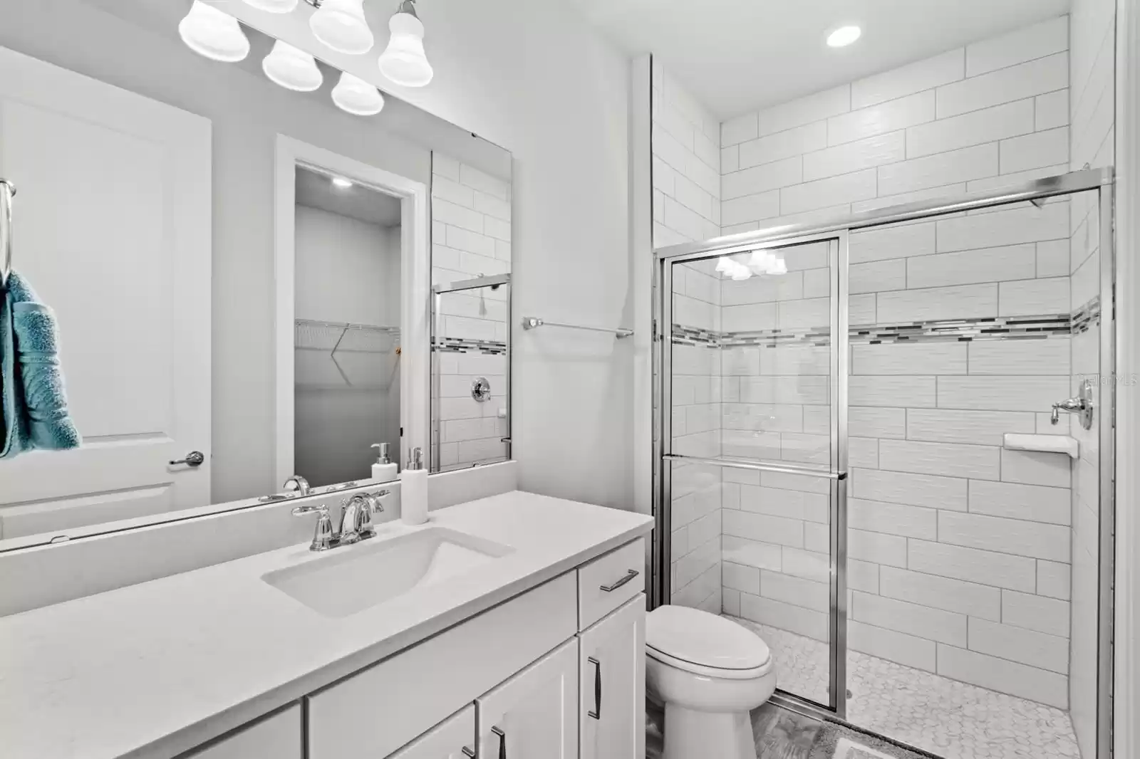 Downstairs guest suite with tile to the ceilings