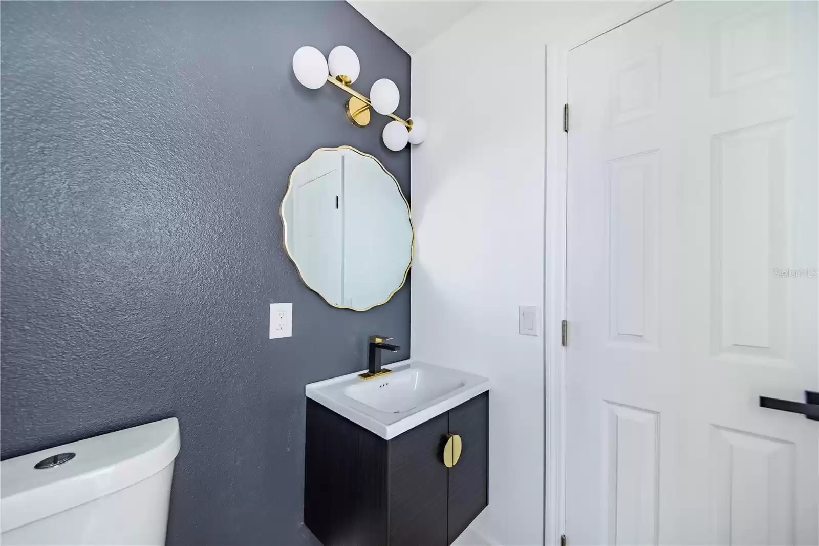 Convenient powder room off entry and easily accessible from kitchen and family room areas