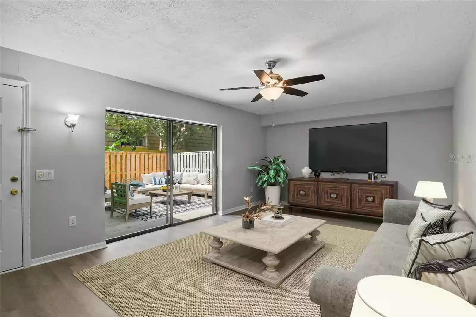 The front door opens to a generous living area complete with a ceiling fan and sliding glass door access to the courtyard for great natural light and enjoying the crisp cool air when Winter comes to Florida. Virtually Staged.