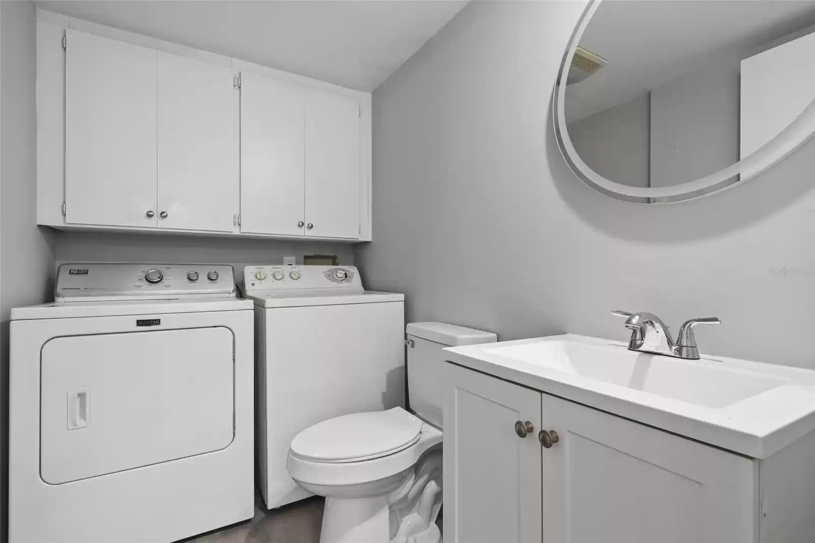 The main floor also delivers a convenient half bath that houses the laundry area and additional storage.