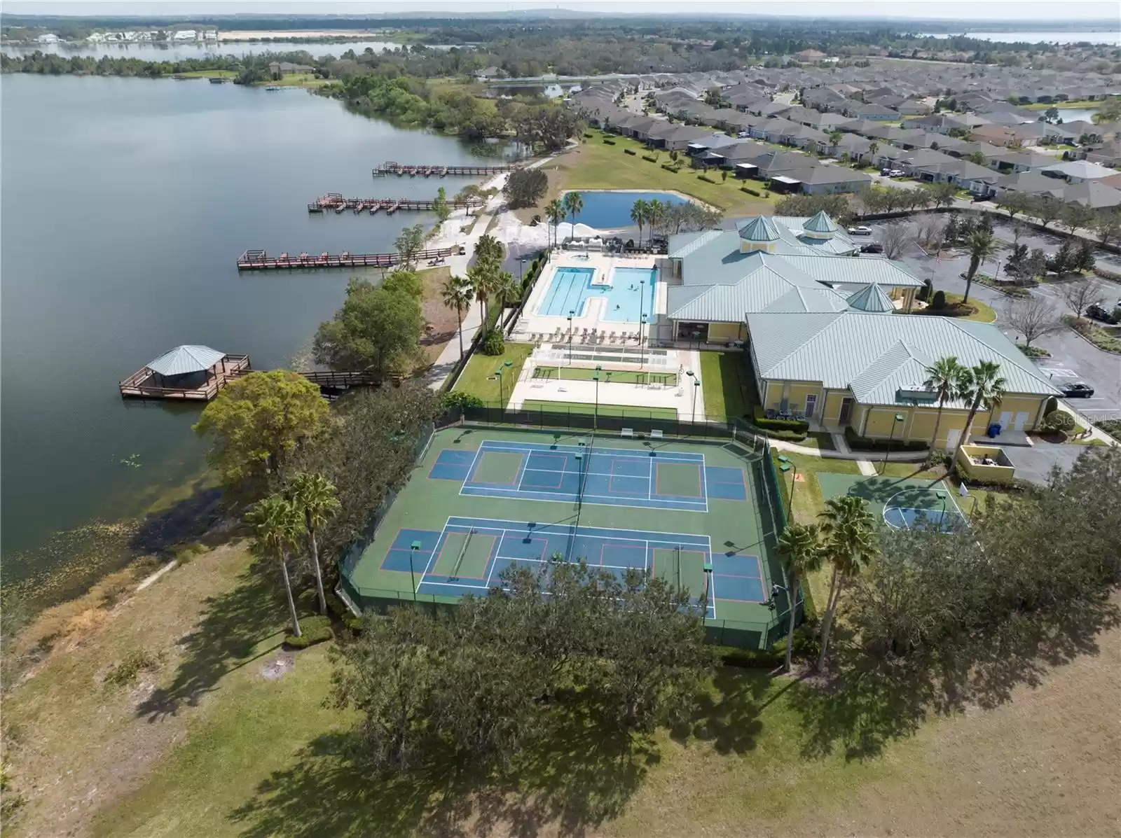 The community offers a variety of amenities, including a tennis court, bocce ball, cornhole toss, shuffleboard, and so much more!