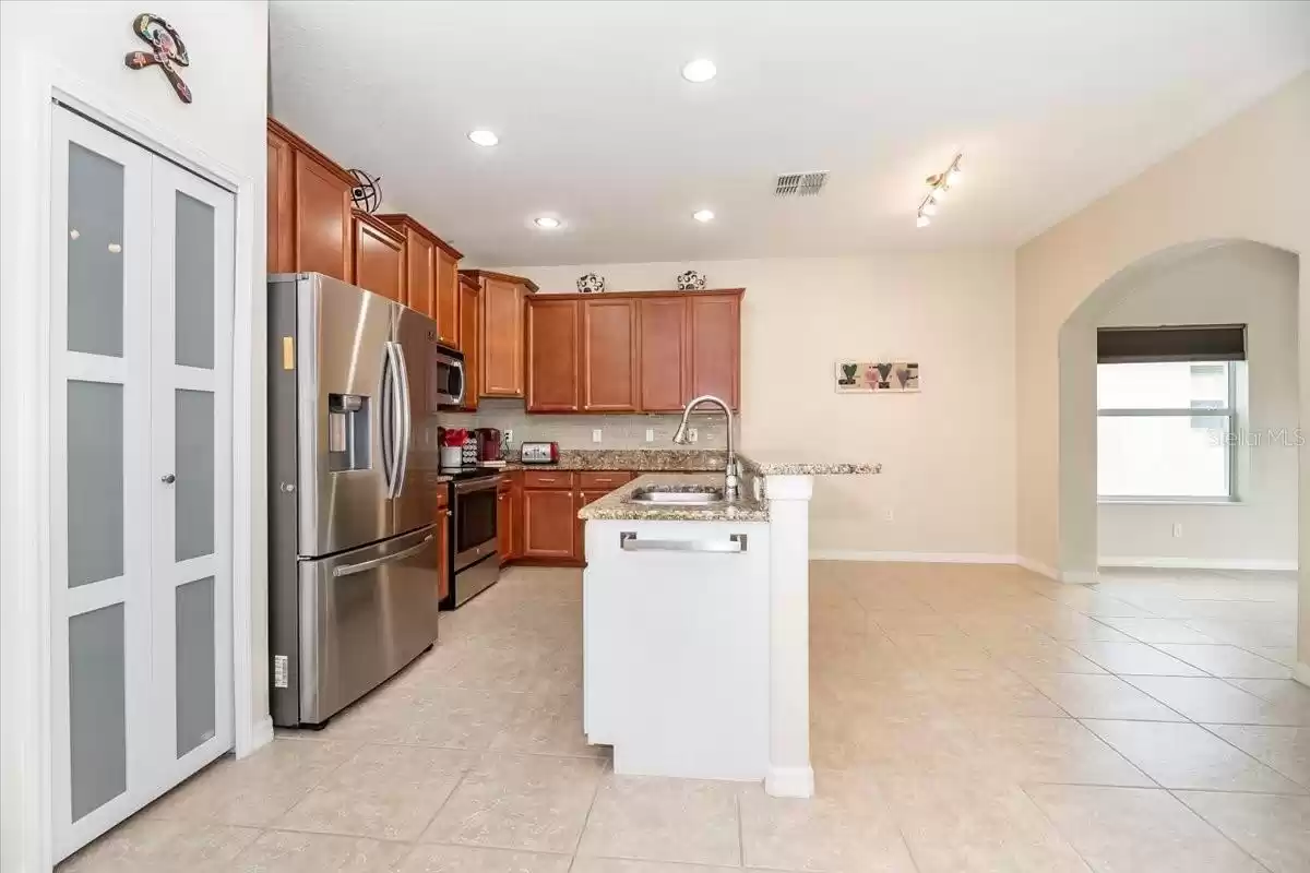 Other features include a stainless steel smart refrigerator, other stainless steel appliances, a pantry, and a delightful breakfast nook.