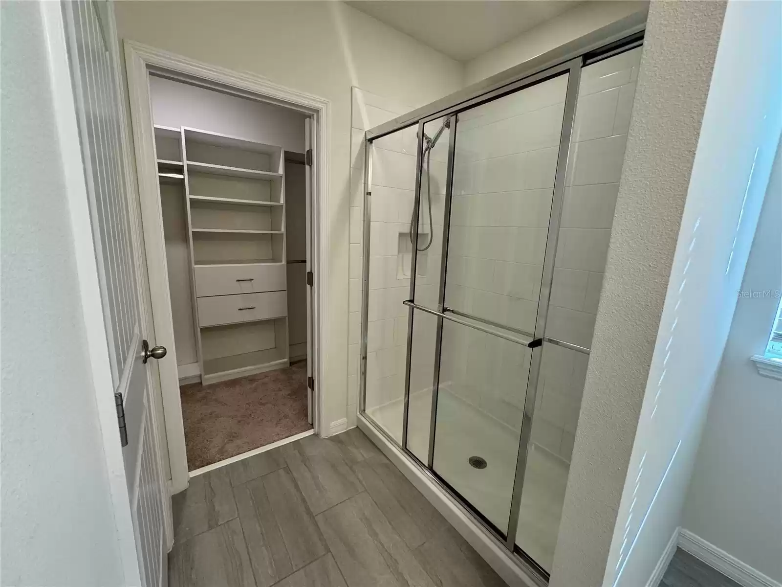 master shower with large custom closet