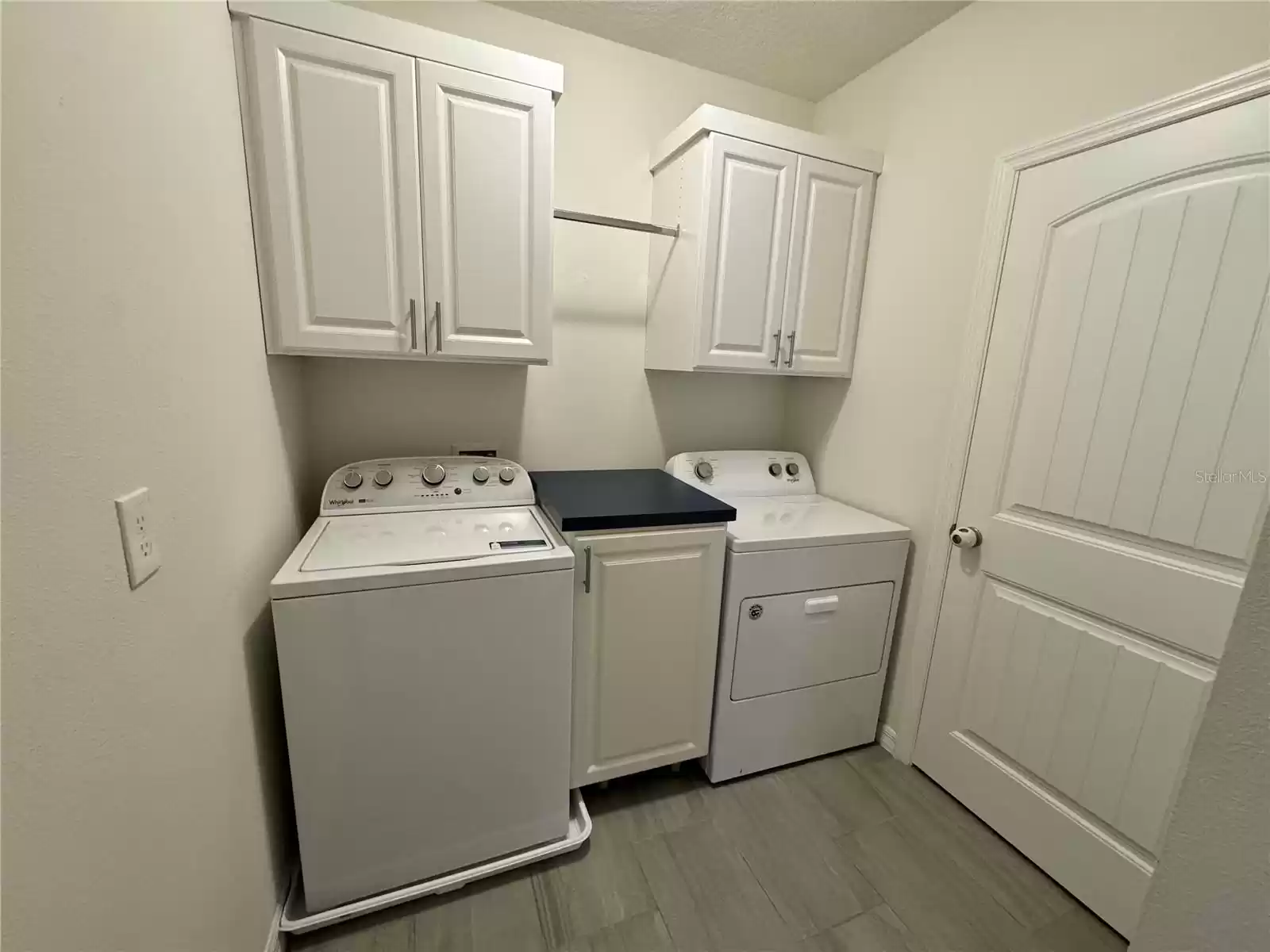 washer/dryer and more storage cabinets