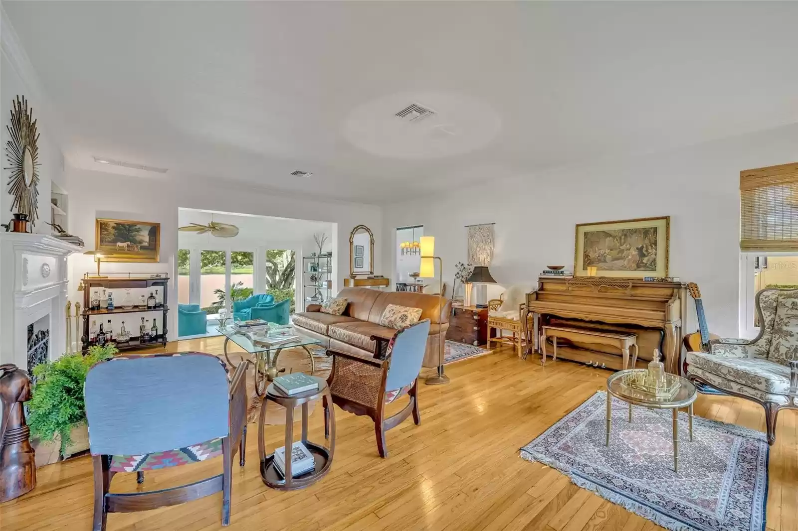 Formal living room with front and back yard views