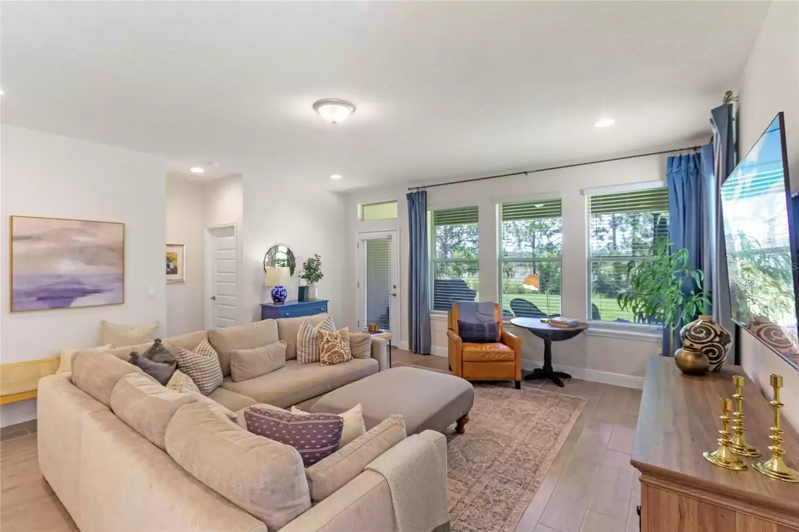 Great room overlooking back covered porch and lake view.