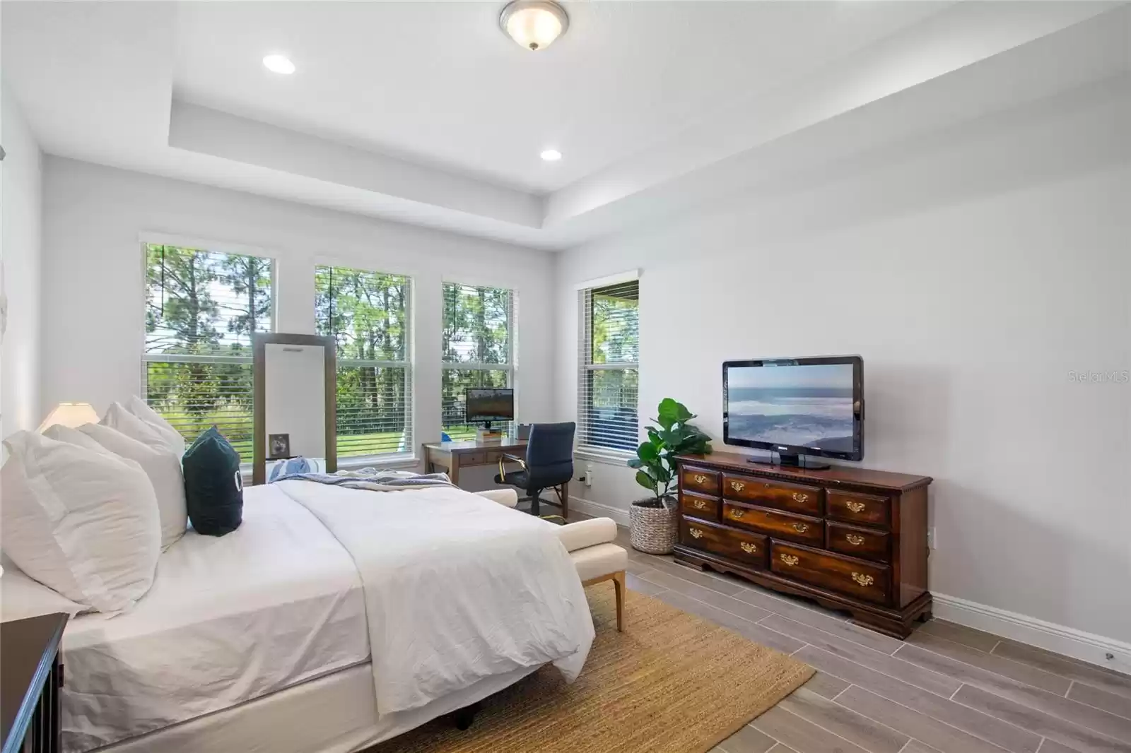 Primary bedroom overlooking private back yard.