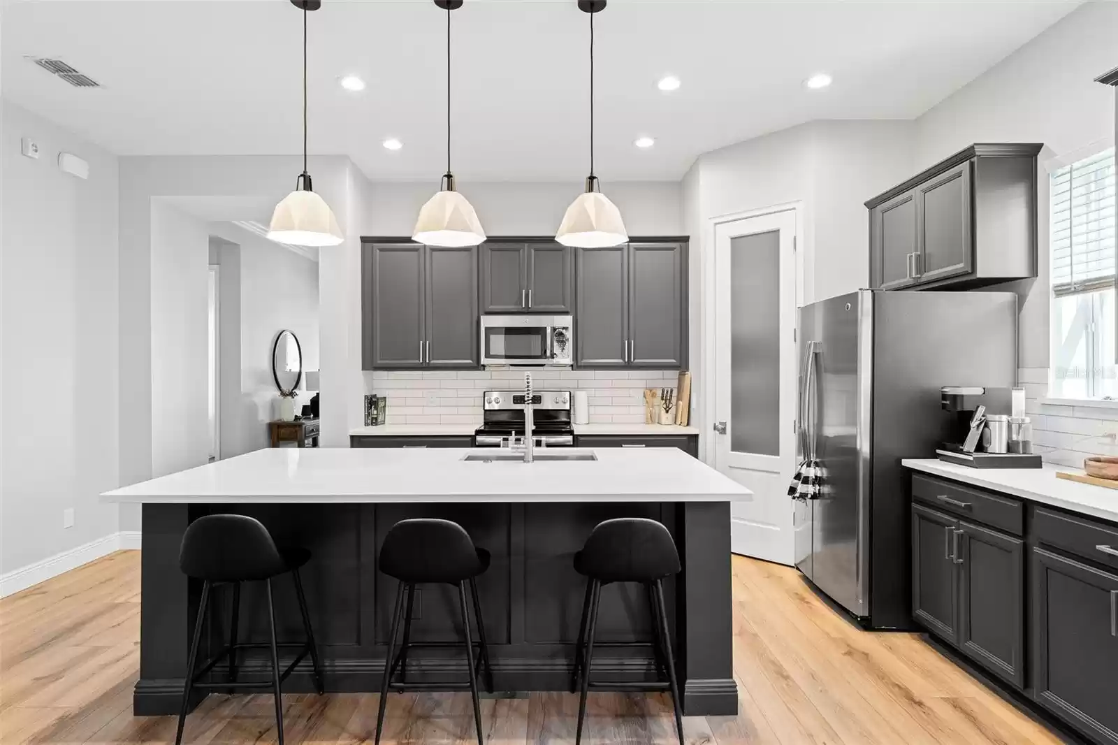 Kitchen island with pendant lighting.