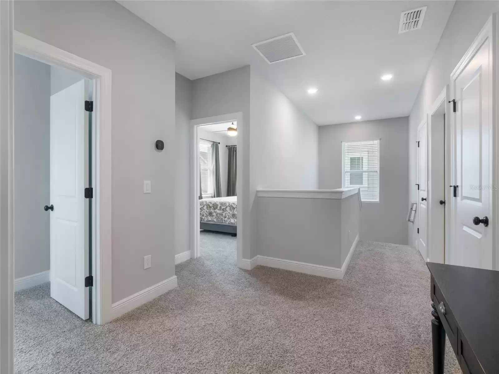 large hallway in between the secondary bedrooms