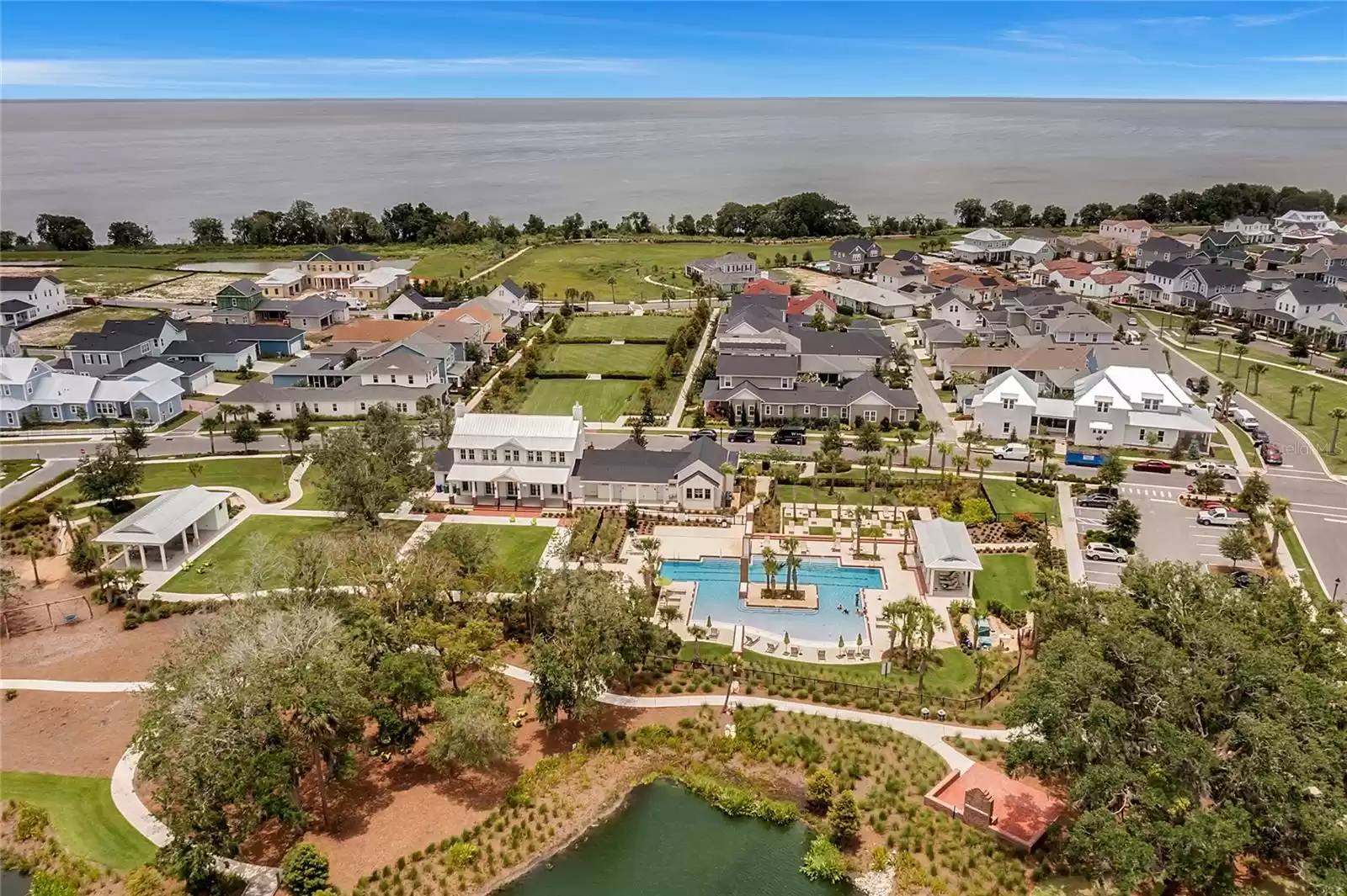 Community pool and club house with Lake Apopka in the distance