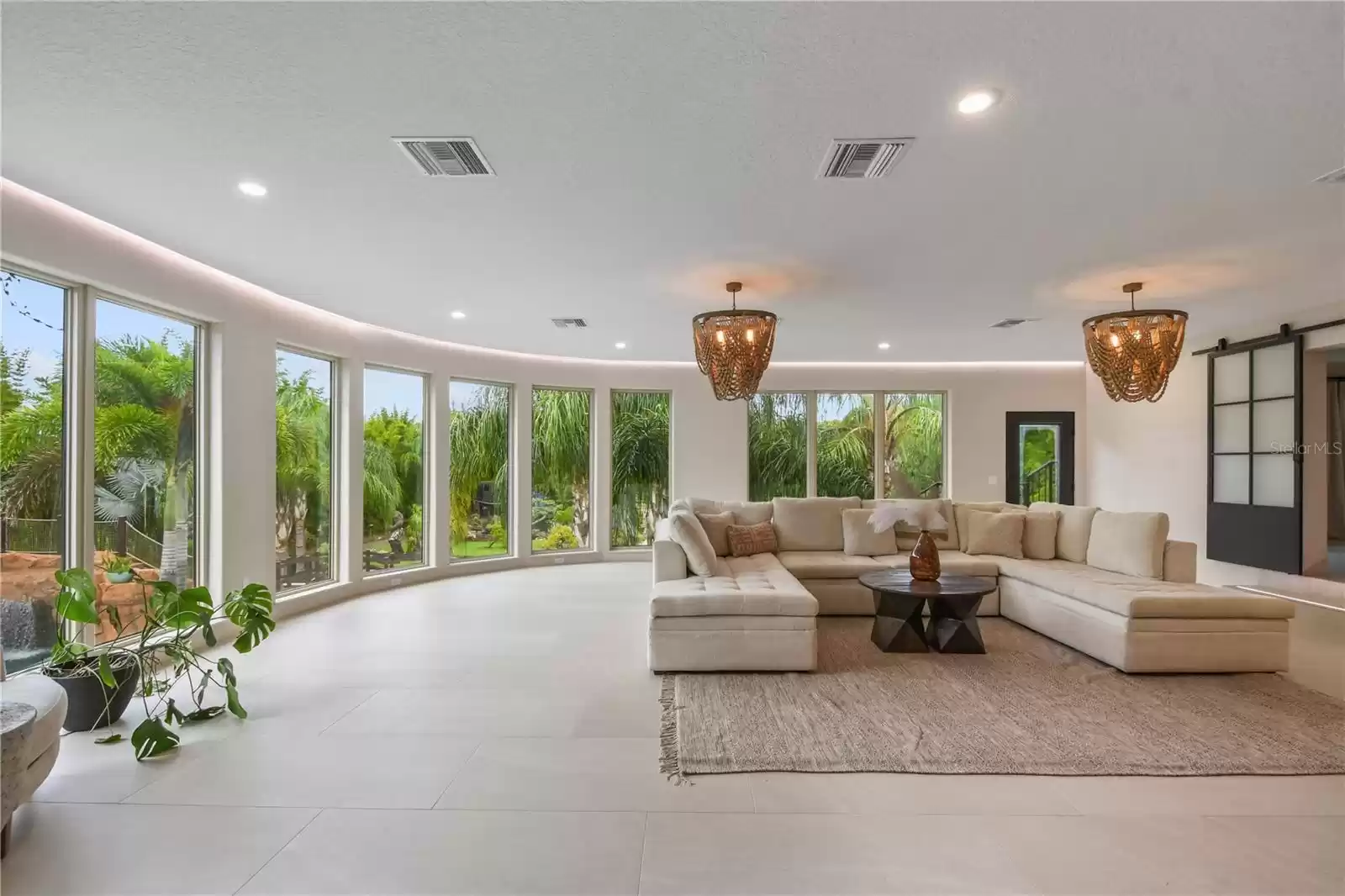 Addition Living Room with view of pool