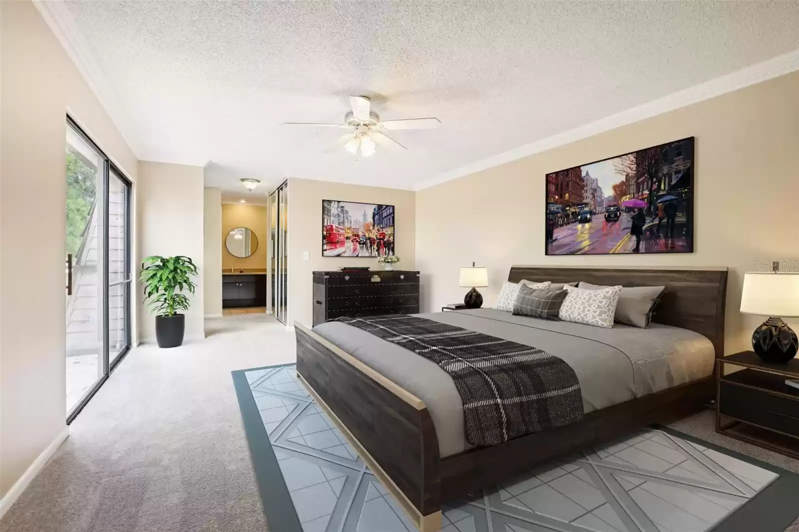 The guest bedroom offers sliding glass door access to a juliet balcony for great natural light while your primary suite features DUAL CLOSETS (one is a WALK-IN!) and a private en-suite bath, also updated. Virtually Staged.