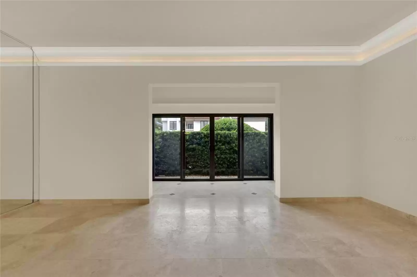 Living room to sunroom and patio