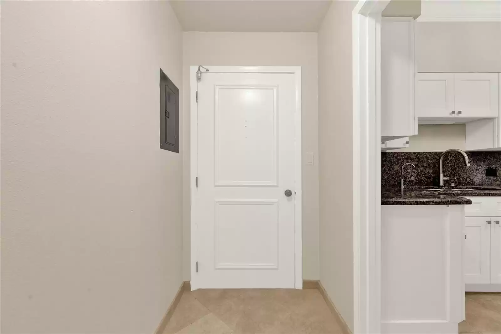 View of front door inside of unit.