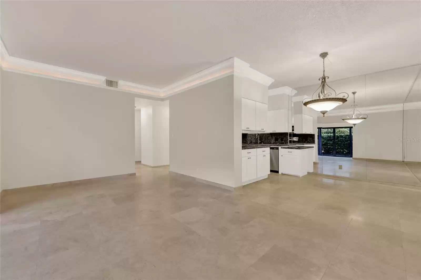 Living room view to dining and kitchen