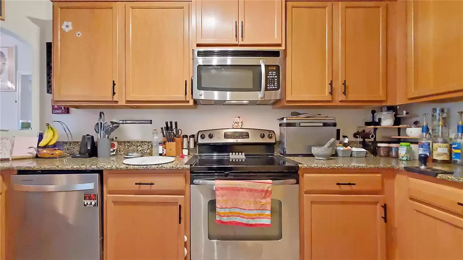 Kitchen with Stainless Steel appliances and solid stone countertops