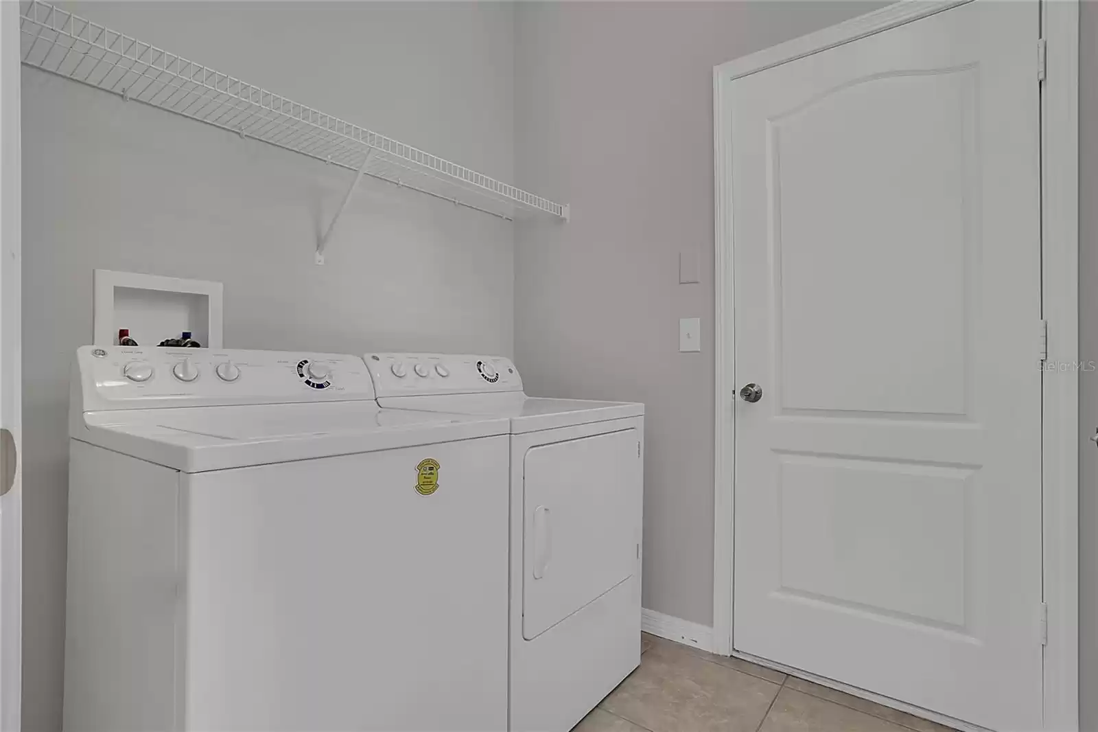 Full laundry room with washer and dryer incl