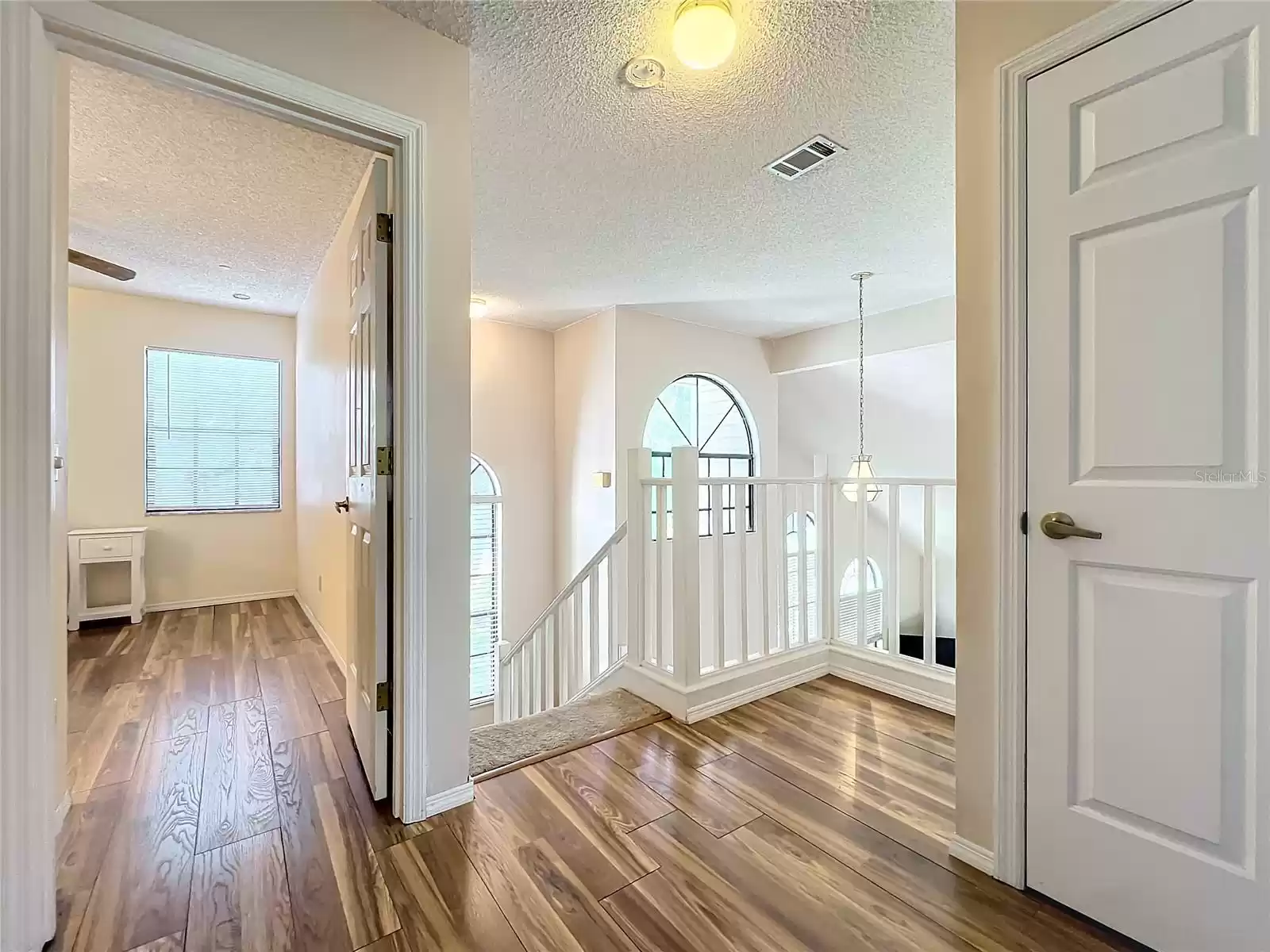 Large windows let the light in to accent the new LPV flooring - Entrance to Bedroom #2