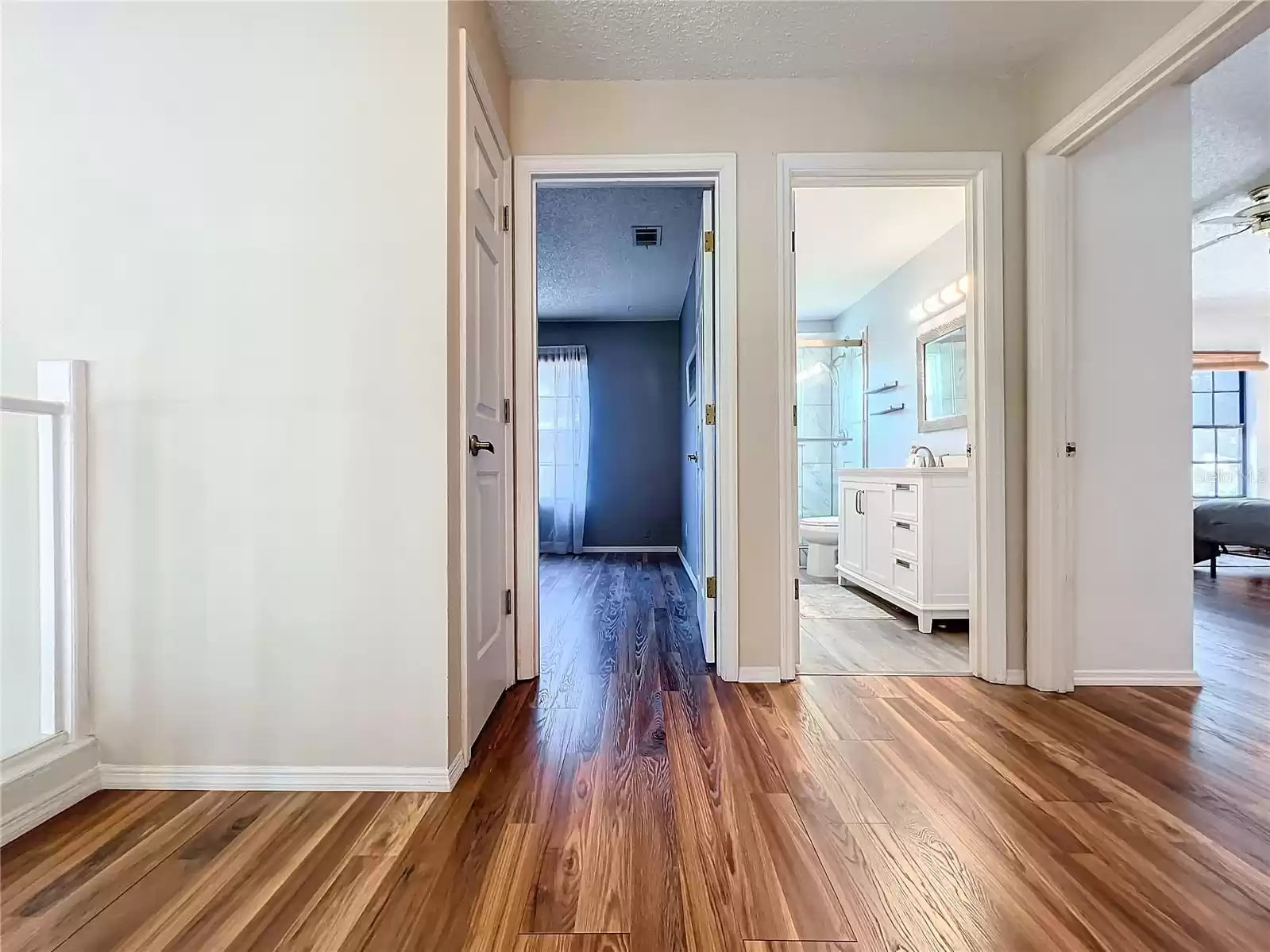 Just look at these beautiful floors!! Entrance to bedroom #3 and Remodeled bathroom.