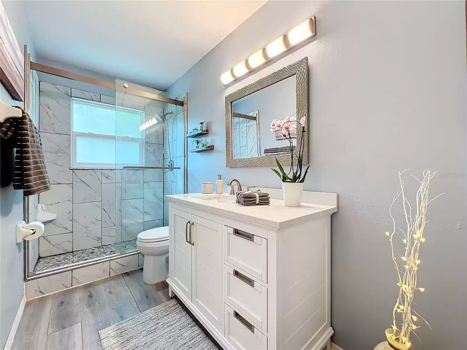 Your Beautiful Remodeled Main Bath Features a Walk-in Shower and Updated Fixture