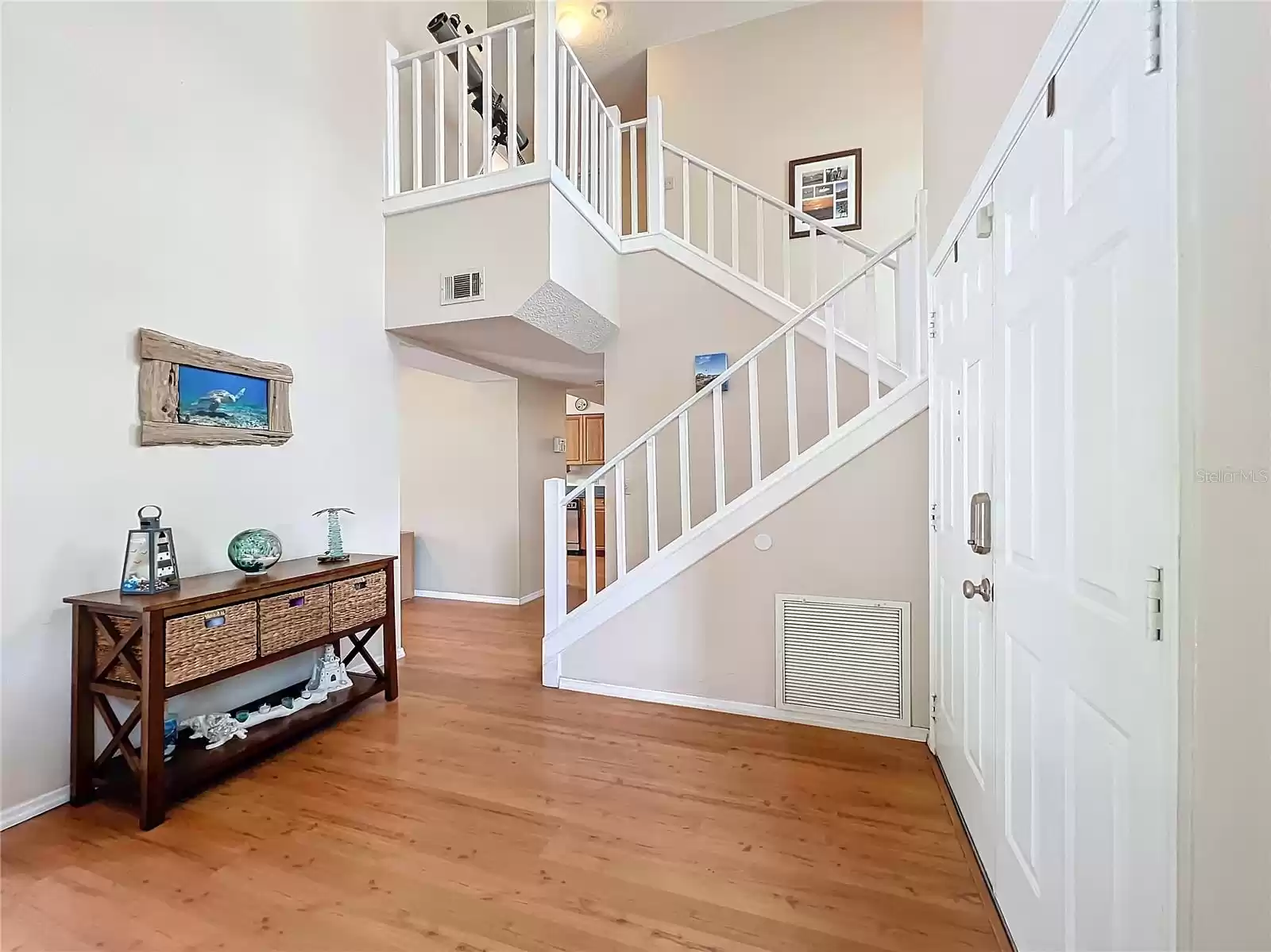 Your Foyer with Soaring Ceilings & Dramatic Staircase